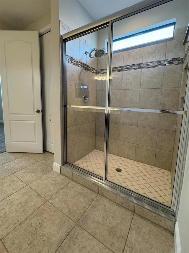 bathroom featuring tile patterned floors and walk in shower