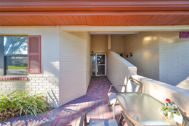 entrance to property with a patio