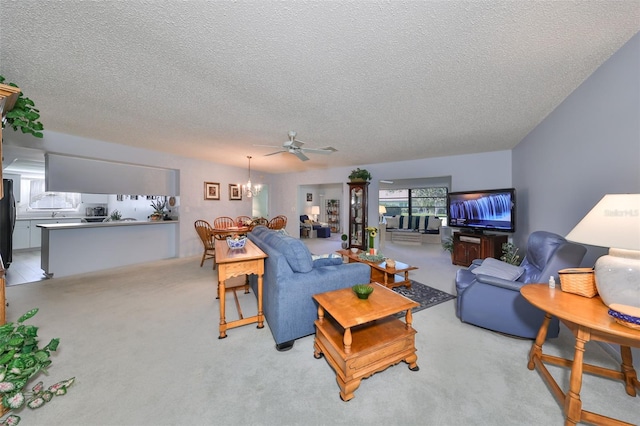 living room featuring light carpet and a textured ceiling