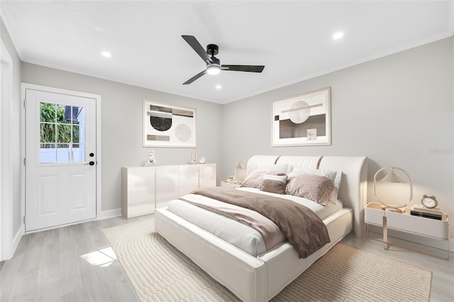 bedroom with ceiling fan, light wood-type flooring, and ornamental molding