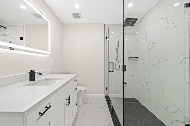 bathroom with vanity, toilet, and an enclosed shower