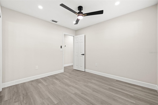 spare room with ceiling fan and light hardwood / wood-style floors