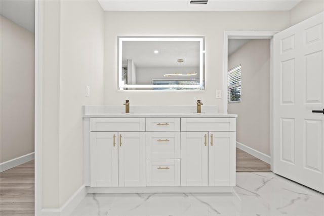 bathroom with vanity and hardwood / wood-style flooring