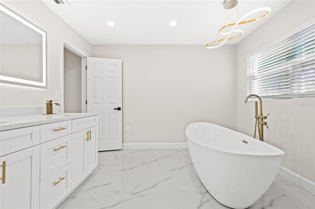 bathroom with a bathing tub and vanity