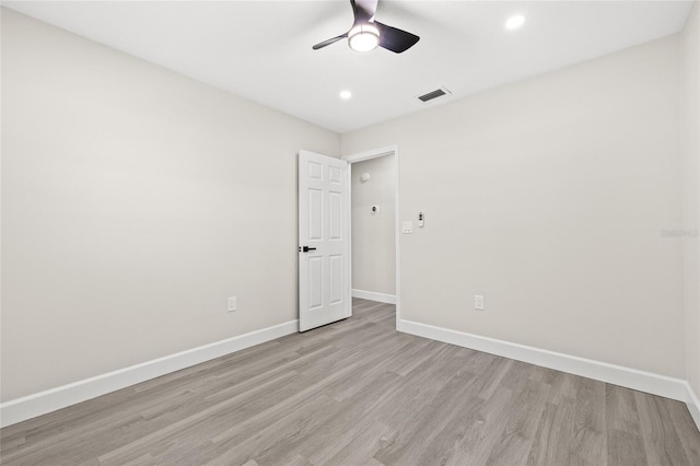 empty room featuring light hardwood / wood-style floors and ceiling fan