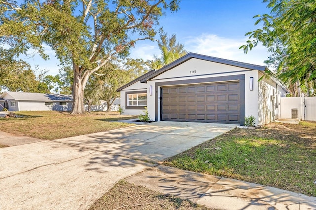 single story home featuring central AC and a front lawn