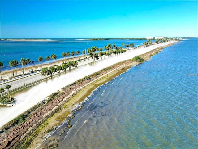 birds eye view of property with a beach view and a water view