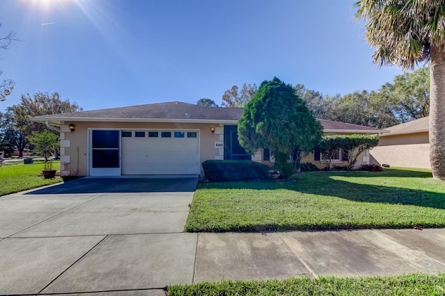 ranch-style house featuring a garage and a front lawn