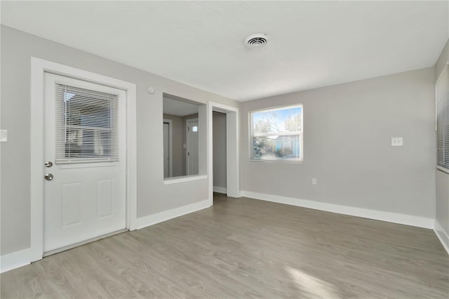 unfurnished room featuring light hardwood / wood-style floors