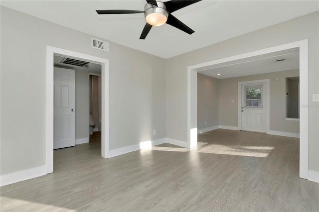 spare room featuring ceiling fan and light hardwood / wood-style flooring