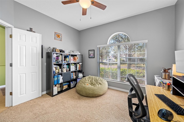 office space with carpet floors, ceiling fan, and a healthy amount of sunlight