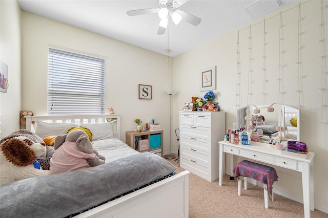 bedroom with ceiling fan and light colored carpet