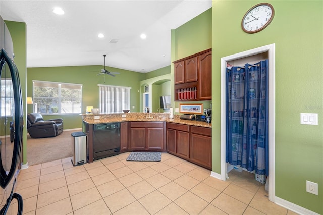 kitchen featuring black appliances, vaulted ceiling, ceiling fan, light tile patterned floors, and kitchen peninsula