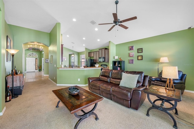 living room with light carpet, high vaulted ceiling, and ceiling fan