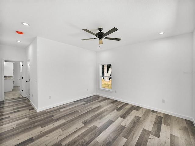 spare room with ceiling fan and hardwood / wood-style floors