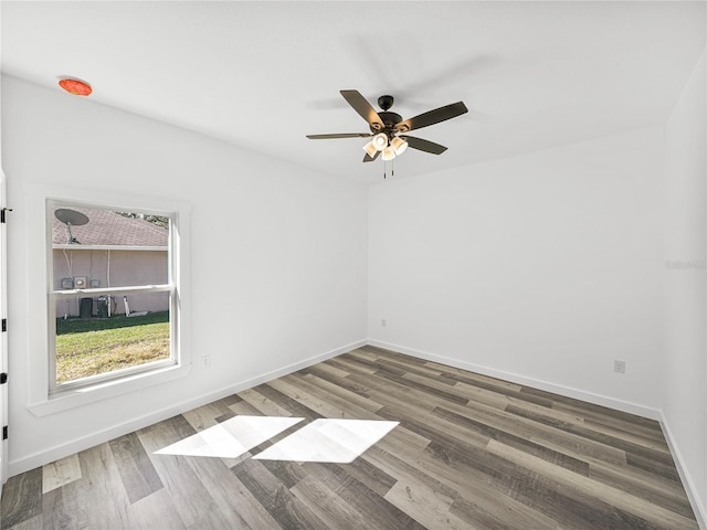 spare room with ceiling fan and hardwood / wood-style floors