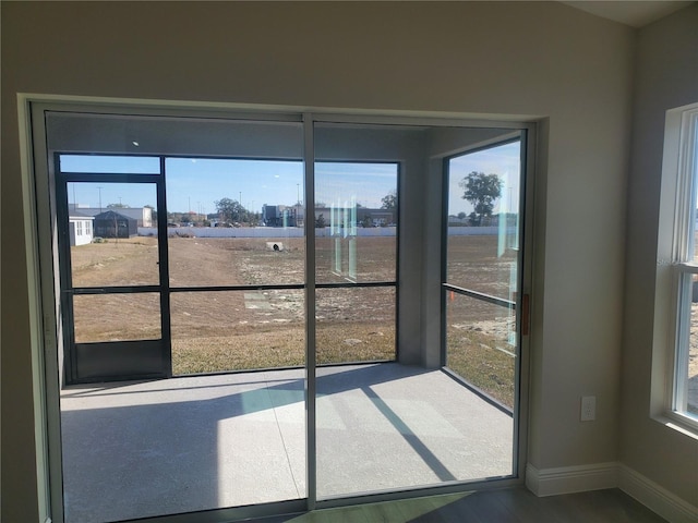 unfurnished sunroom with plenty of natural light