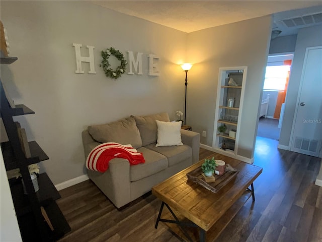 living room featuring dark hardwood / wood-style floors