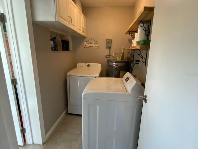 washroom with cabinets, separate washer and dryer, and water heater