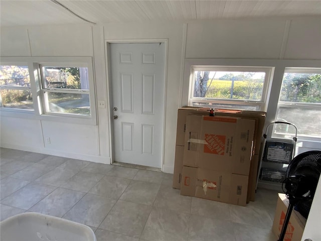 foyer featuring light tile patterned floors