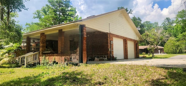 view of home's exterior featuring a porch and a garage