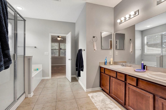 bathroom with vanity, plus walk in shower, tile patterned flooring, ceiling fan, and a textured ceiling