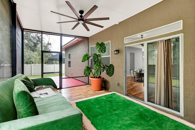 sunroom featuring ceiling fan