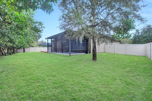 view of yard with a sunroom