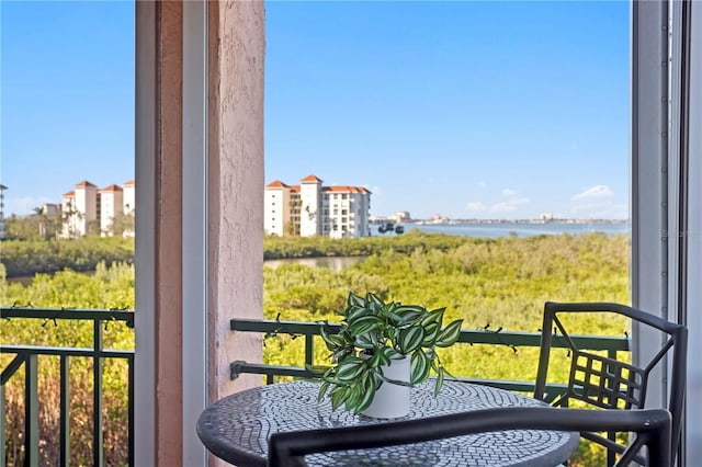 balcony featuring a water view