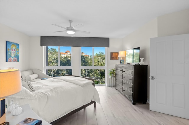 bedroom featuring light hardwood / wood-style floors and ceiling fan