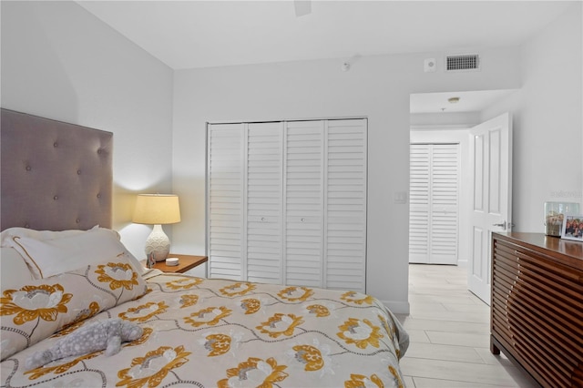 bedroom featuring light hardwood / wood-style flooring and a closet