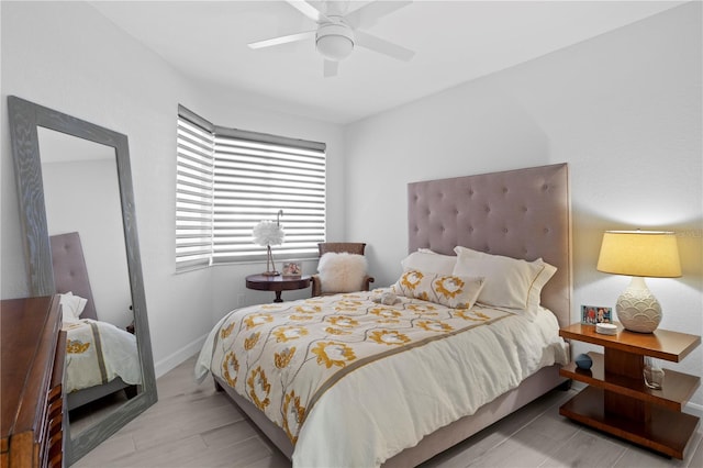 bedroom featuring ceiling fan and light hardwood / wood-style flooring