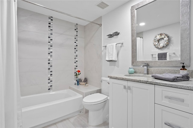 full bathroom featuring tile patterned flooring, shower / bath combo, toilet, and vanity