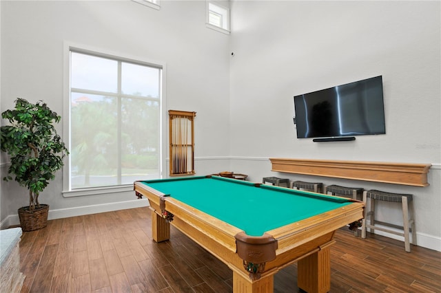 playroom with a high ceiling, dark hardwood / wood-style flooring, and pool table