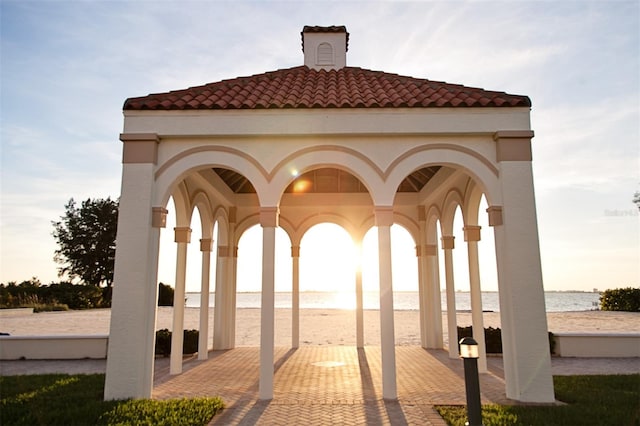 exterior space with a gazebo and a water view