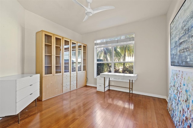 interior space with hardwood / wood-style floors and ceiling fan