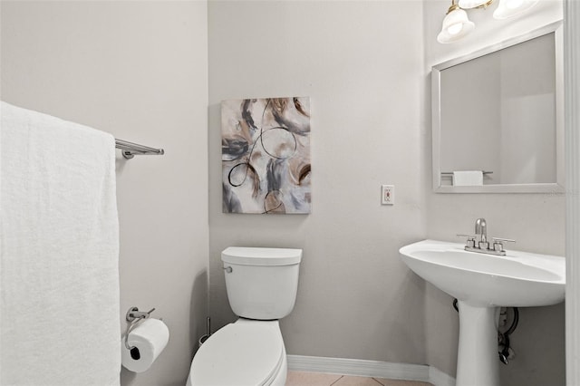 bathroom featuring tile patterned flooring and toilet