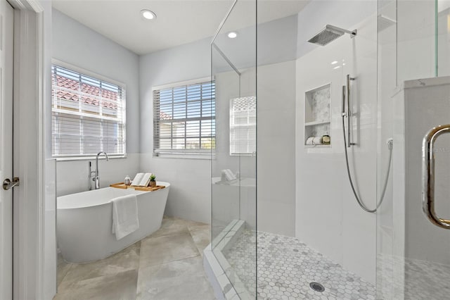 bathroom with plus walk in shower and tile patterned floors