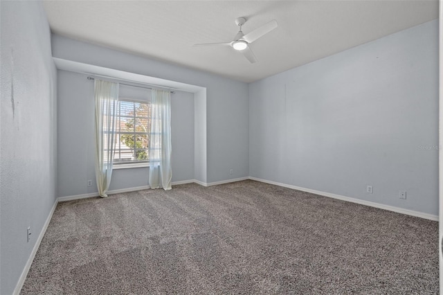 unfurnished room with ceiling fan and carpet floors