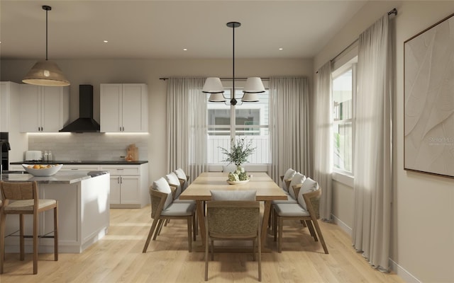 dining space featuring light hardwood / wood-style flooring and a wealth of natural light