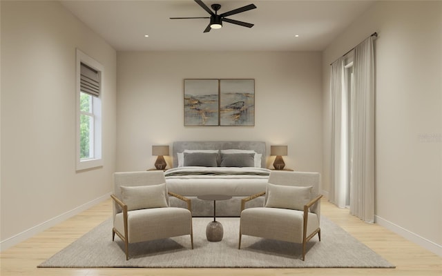 bedroom with light hardwood / wood-style flooring and ceiling fan