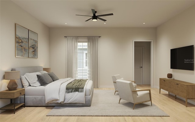 bedroom with ceiling fan and light wood-type flooring