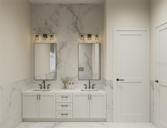 bathroom featuring vanity and tile walls