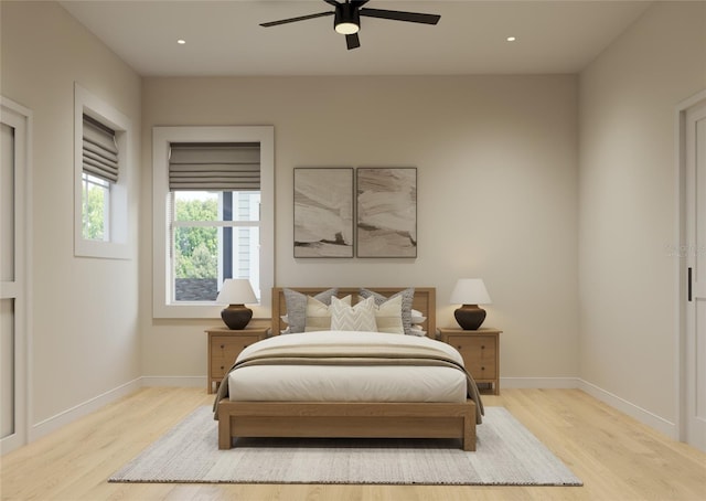 bedroom featuring ceiling fan and light hardwood / wood-style flooring