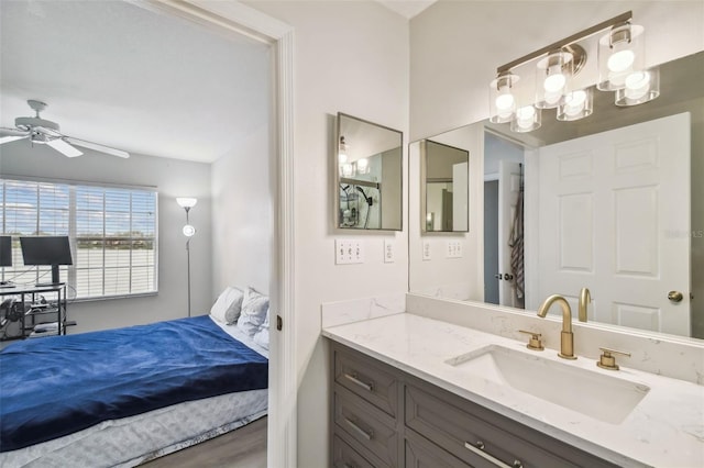 bathroom featuring ceiling fan, vanity, and hardwood / wood-style floors