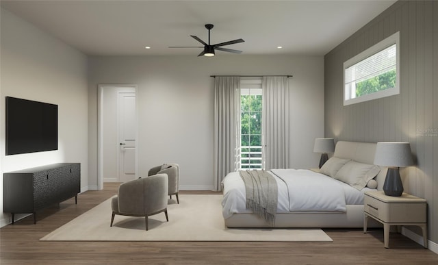 bedroom with ceiling fan and wood-type flooring