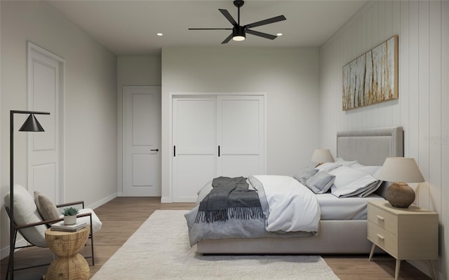 bedroom featuring light wood-type flooring and ceiling fan