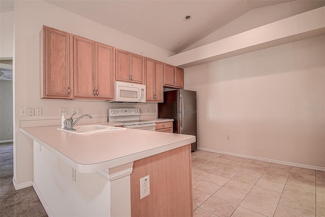 kitchen featuring sink, kitchen peninsula, vaulted ceiling, white appliances, and light tile patterned floors