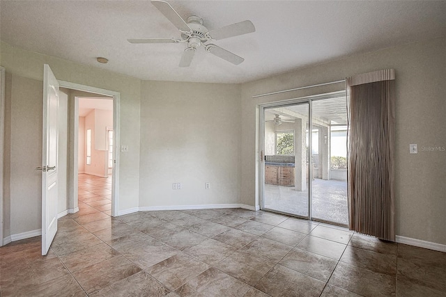 unfurnished room with ceiling fan