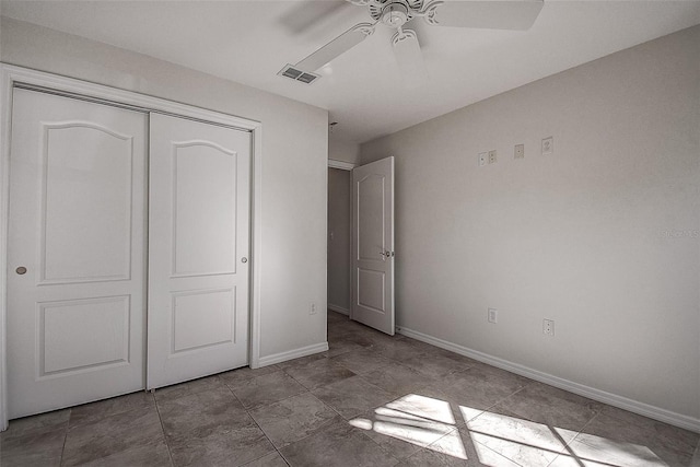 unfurnished bedroom featuring a closet and ceiling fan